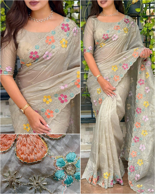 A perfect festive beauty, Grace meets glamour in this ethereal dusty beige colored saree adorned with exquisite beads embroidery with thread work. Perfect for any celebration.