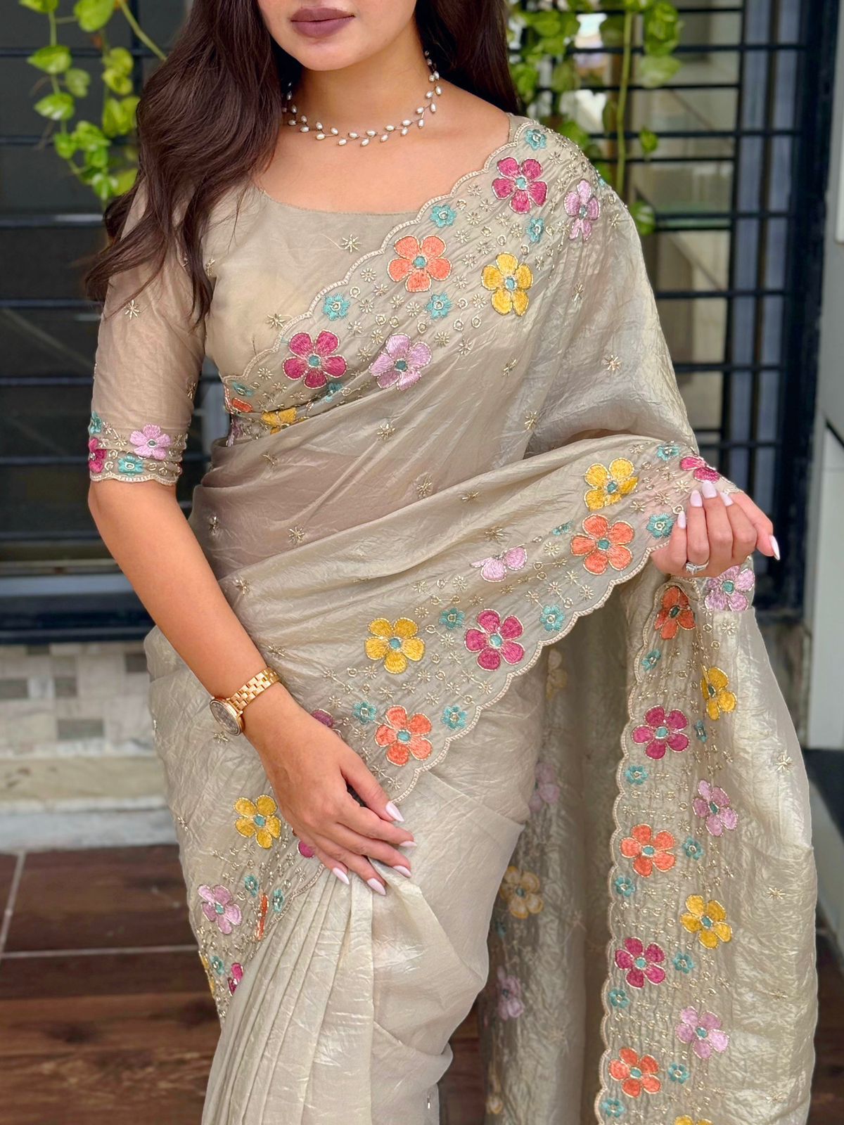 A perfect festive beauty, Grace meets glamour in this ethereal dusty beige colored saree adorned with exquisite beads embroidery with thread work. Perfect for any celebration.