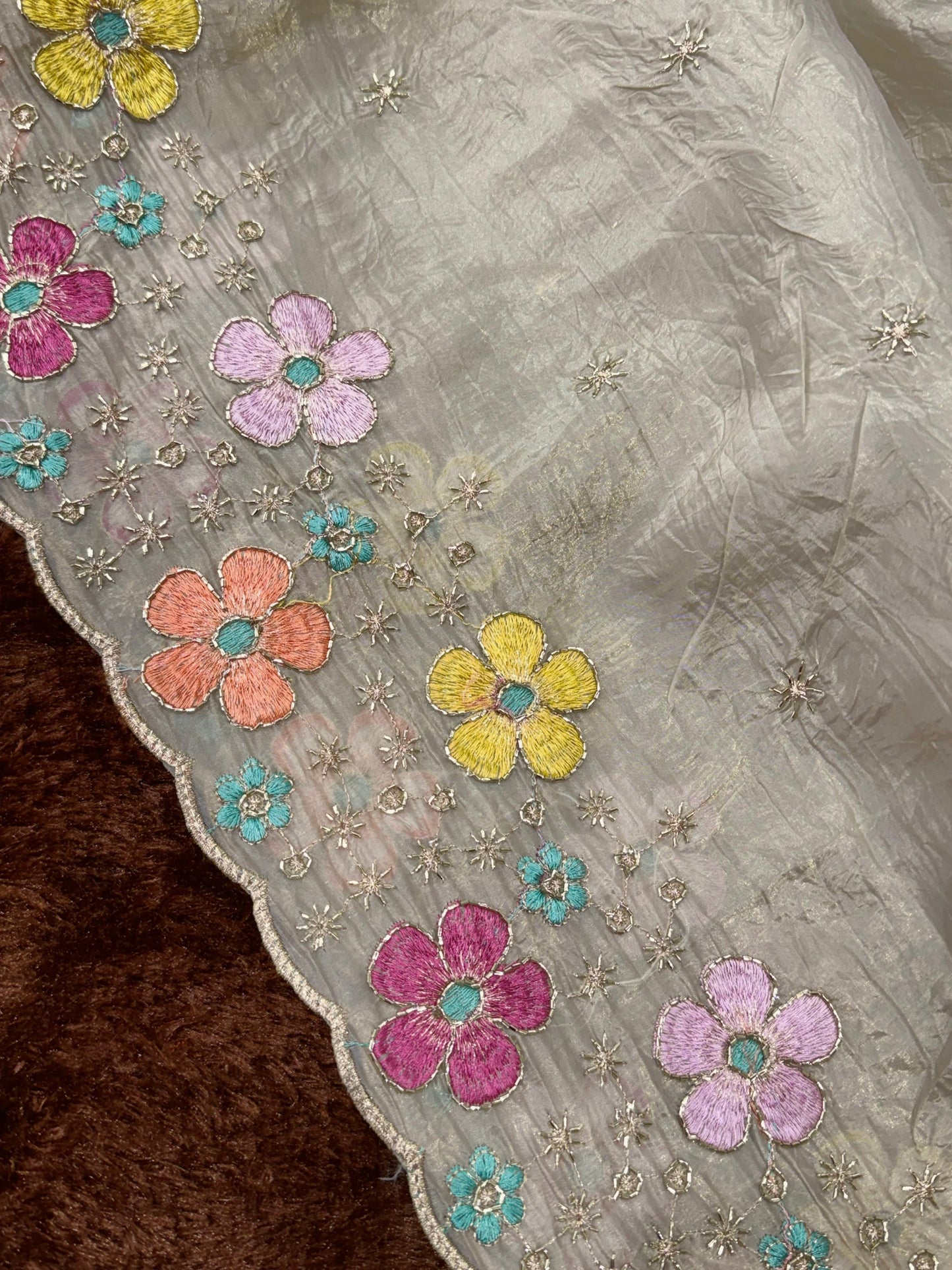 A perfect festive beauty, Grace meets glamour in this ethereal dusty beige colored saree adorned with exquisite beads embroidery with thread work. Perfect for any celebration.