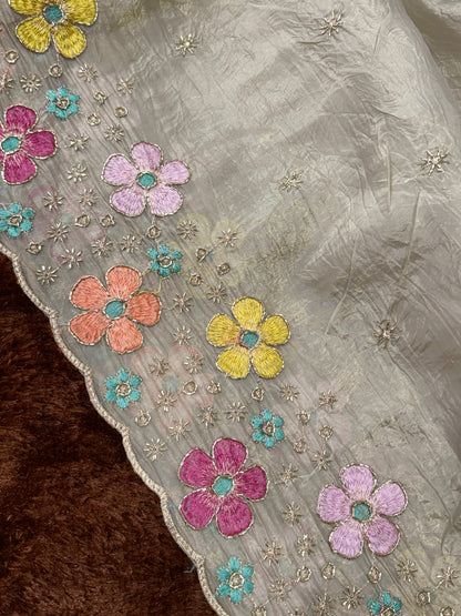 A perfect festive beauty, Grace meets glamour in this ethereal dusty beige colored saree adorned with exquisite beads embroidery with thread work. Perfect for any celebration.
